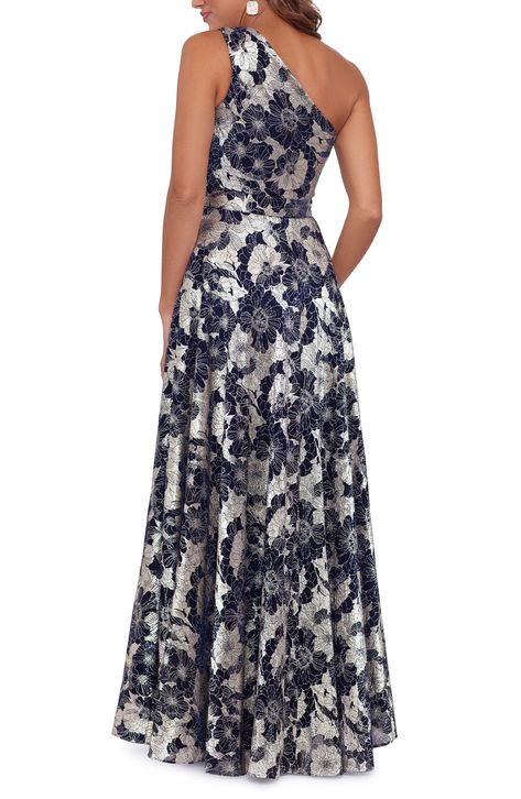 A cutout at the one-shoulder neckline adds contemporary allure to a fit-and-flare gown covered in a stunning metallic floral print. 61" length (size 8) Hidden side-zip closure One-shoulder neck Sleeveless Lined 50% polyester, 50% metallic fibers Spot clean Imported Floral Print Gowns, Dress Code Wedding, Printed Gowns, Shoulder Wrap, One Shoulder Gown, Sleeveless Gown, Floral Gown, Evening Dresses Plus Size, Sophisticated Dress