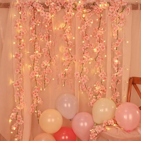 PRICES MAY VARY. PACKAGE AND SIZE: There are 4 pcs artificial cherry blossom garlands, a 32.8 ft long LED string lights and 15 pcs colorful balloons in one package. Total length of 23.6 FT/7.2 M, flowers measures 3.2 inches in diameter, 144 pcs cherry blossoms on each vine. Full and lovely artificial cherry blossoms meet decorative needs. PREMIUM MATERIAL: Artificial cherry blossom flowers are made of premium silk cloth, while the vine is flexible plastic, flowers are full and colorful, lifelike Cherry Blossom Balloon Arch, Japan Themed Party Decorations, Cherry Blossom Decorations Party, Cherry Blossom Birthday Theme, Cherry Blossom Party Theme, Cherry Blossom Quinceanera Theme, Cherry Blossom Themed Wedding, Bday Snacks, Pink Themed Party