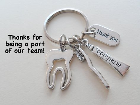 "This listing is for 1 keychain.  These are great gifts for dental assistants and coworkers.   The keychain will come attached to card that says \"Thanks for being a part of our team!\" See my other medical related items here:  https://www.etsy.com/shop/JewelryEveryday?ref=seller-platform-mcnav&search_query=medical Check out my other employee appreciation keychain listings here: https://www.etsy.com/shop/JewelryEveryday/search?search_query=employee&order=date_desc&view_type=gallery&ref=shop_sear Dental Assistant Gifts, Gift Coworker, Assistant Gifts, Toothbrush Toothpaste, Pinky Promise, Employee Appreciation, Dental Assistant, Keychain Set, Employee Gifts