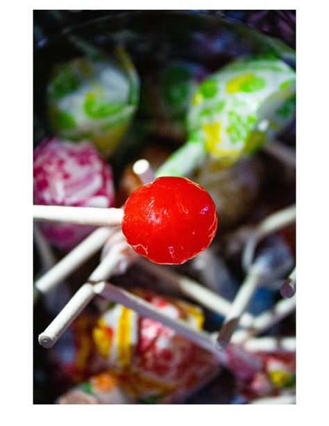 I really like this photo because of the virbant colors and short depth of field. I really like hwo the light glistens off of the lolipop. ISO: 3600 F: 5.6 Shutter Speed: 1/320 Short Depth Of Field Photography, Unique Perspective Photography, Large Depth Of Field Photography, Depth Of Field Photography Ideas, Deep Depth Of Field Photography, Low Shutter Speed Photography, Shallow Depth Of Field Photography, Aperture Examples, Depth Of Field Photography