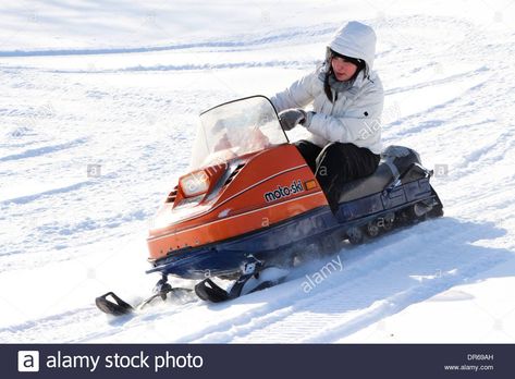 Download this stock image: A woman in her early 30s enjoying a snowmobile ride after a fresh snowfall in Quebec, Canada. - DR69AH from Alamy's library of millions of high resolution stock photos, illustrations and vectors. Fresh Snowfall, Quebec Canada, Riding Lawnmower, Snowmobile, A Woman, High Resolution, Stock Images, Resolution, Stock Photos