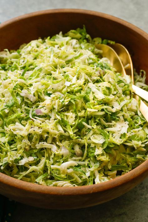 NYT Cooking: Like cabbage, raw brussels sprouts do well when shredded and mixed with a tart apple, lemon juice and zest, and a dressing of Dijon mustard and mayonnaise. It’s not a traditional slaw, but the concept is the same. Serve this immediately, or give it some time in the fridge to let the flavors meld. (You may want to drain it before serving if it has released a lot... Brussels Sprout Slaw, Brussel Sprout Slaw, Maple Mustard, Leafy Green Salads, Sprouts Salad, Brussels Sprout, Brussel Sprout Salad, Healthier Choices, Slaw Recipes