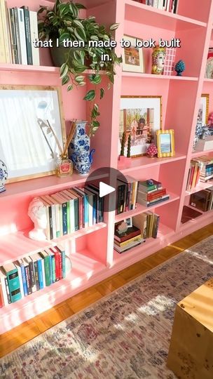 167K views · 7.6K reactions | Ashley's 480-square-foot D.C. studio has a giant pink bookcase DIY. | By Apartment Therapy | Hi, my name is Ashley and this
is my 480 square foot apartment in Washington DC. My favorite
thing about my apartment is just how I've been able to
maximize space that feels like it has a home office, a living
room, and a bedroom. When it comes to my design process, I
always begin with space planning. I measure every inch
and I try an endless amount of combinations of furniture. My
top three DIY's in my apartment in my giant pink bookshelf.
It's a combination of four different Billy bookcases that
I then made to look built in my bar cabinet. Another honorable
mention, my TV cabinet, just a base day unit from IKEA. I
painted it, added some hardware, and some legs and I Pink Billy Bookcase, Pink Bookcase, Pink Bookshelf, Pink Bookshelves, Billy Bookcases, My Bar, Bookcase Diy, Billy Bookcase, My Apartment