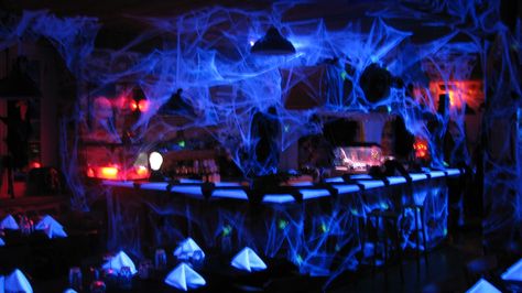 Cobwebs behind bar and by entertainment center Halloween Night Club Decor, Halloween Ballroom, Irish Gothic, London Halloween, Halloween Club Party, Haunted Circus, Halloween Party Bar, Halloween Club, Halloween Bar