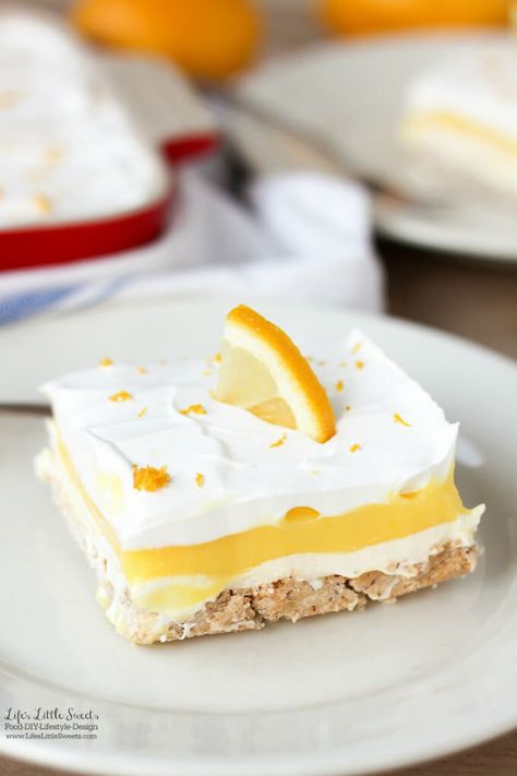 This Dreamy Lemon Lush Dessert Recipe is perfect for Spring and Summer picnics and gatherings. It's so light and refreshing with 4 layers of bottom pecan crust, lemon cream cheese, lemon pudding and topped with a whipped topping garnished with lemon zest. Lemon Lush Recipe, Lemon Lush Dessert, Lemon Desserts Easy, Lush Dessert, Lush Recipes, Lemon Lush, Valentines Recipes Desserts, Potluck Desserts, Low Carb Cheesecake