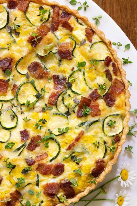 This easy, delicious summer quiche loaded with fresh corn, smoky bacon, parmesan cheese and zucchini makes a fabulous entree for breakfast, lunch or dinner! #summerquiche, #easyquiche, #freshcornquiche, #zucchiniquiche Summer Quiche, Savory Quiche, Sweet Potato Quinoa Salad, Corn Zucchini, Best Greek Salad, Zucchini Quiche, Veggie Quiche, Salad With Balsamic Dressing, Bacon Quiche