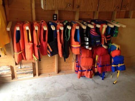 Boat House Storage, Boat Dock Storage Closet Ideas, Life Jacket Rack, Life Jacket Storage, Lake Storage, Jacket Storage, Dock Ideas, Kayak Storage Rack, Lakehouse Ideas