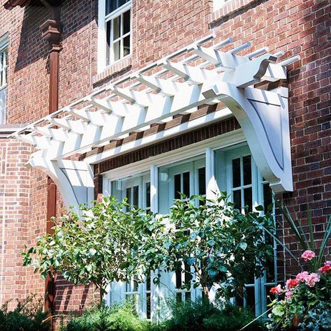 Over-the-Door Pergola - I've never seen this before.  Not sure it works with our Tudor, but I likey. Enclosed Garden Structures, Window Pergolas, Door Pergola, Carport Modern, Attached Pergola, Pergola Diy, Arbors Trellis, Cheap Pergola, Patio Pergola