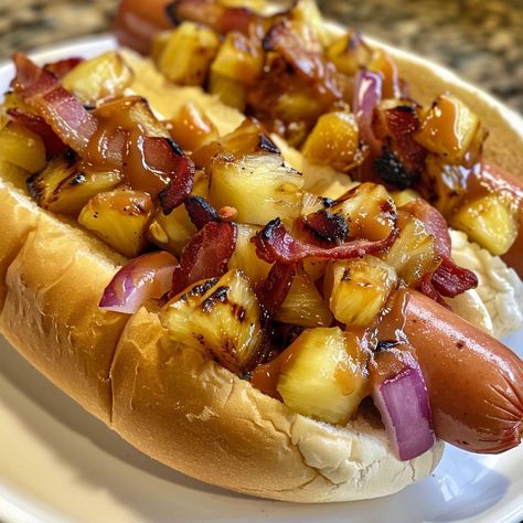 🍍 Tropical flavors meet classic grilling with our Hawaiian Hot Dog! 🌭🌴 #TropicalBite 🍽️ Hawaiian Hot Dog 🛒 Ingredients: Hot dogs: 4 Pineapple: 1 cup, diced Bacon: 4 strips BBQ sauce: 4 tbsp Hot dog buns: 4 Red onion: 1/4 cup, diced 👩‍🍳 Instructions: Grill: Cook hot dogs and bacon. Top: Add pineapple, bacon, onion, and BBQ sauce to buns. Serve: Delight in these island-inspired dogs! 🌺 Bring a taste of Hawaii to your table with our Hawaiian Hot Dogs! #AlohaFlavors #SummerGrilling Cook Hot, Hot Dog Toppings, Sausage Dishes, Instagram Recipes, Twisted Recipes, Hot Dog Recipes, Summer Grilling, Trending Recipes, Family Dinner Recipes