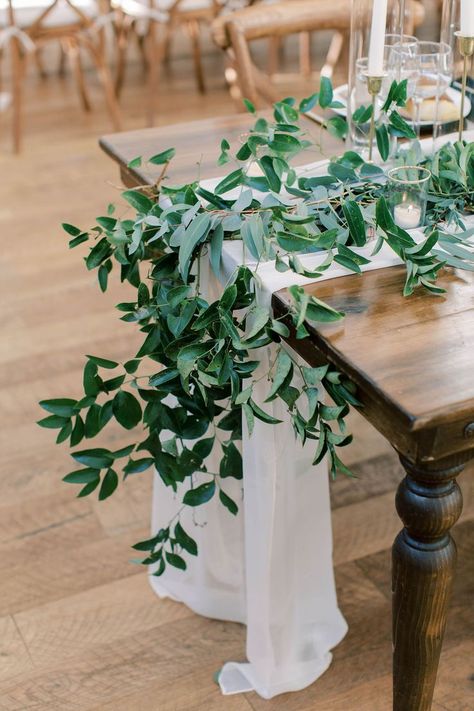 Smilax greenery cascade off table Smilax Greenery, Wedding Farm Table, Farm Table Wedding, Candlelit Table, Wedding Farm, Bee Wedding, Pool Wedding, Greenery Centerpiece, Pool Decor