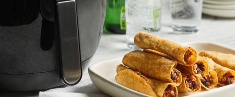 The air fryer cooks these taquitos just right—crunchy on the outside and tender on the inside. Air Fryer Taquitos, Healthy Vegan Diet, Forks Over Knives, How To Cook Mushrooms, Cooking Courses, Vegan Recipes Healthy, Black Bean, Week Meal Plan, Food App