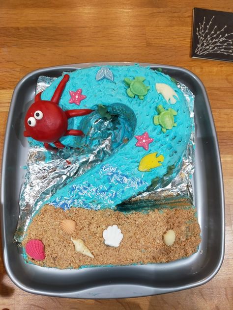 Under the sea birthday cake, crushed up biscuits used for the sand, big octupus made out of icing, white chocolate sea turtles and sea shells. Blue icing all over. In the shape of a big number 2. Simple Under The Sea Cake, Under The Sea Birthday Cake, Sea Birthday Cake, Beach Birthday Cake, Underwater Birthday, Under The Sea Cake, Sand Cake, Sea Cake, 1 Year Birthday