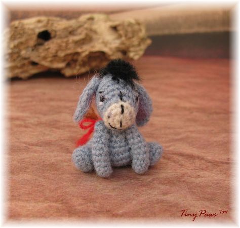 Eeyore is 1 ¼" tall sitting, including his hair. Made out of tiny crochet stitches with very fine acrylic threads. His body parts are each made separately and then 5-way thread jointed. His facial features are carefully embroidered. cgi.ebay.com/ws/eBayISAPI.dll?ViewItem&item=250694307... Eeyore Crafts, Eeyore Amigurumi, Eeyore Crochet, Miniature Knitting, Tiny Crochet, Miniature Crochet, Micro Crochet, Crochet Disney, Crochet Buttons