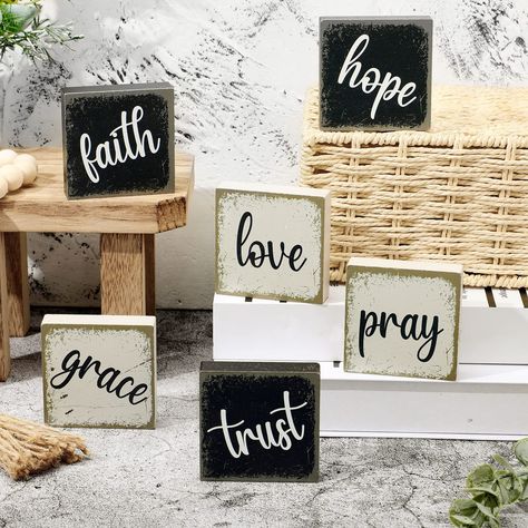 PRICES MAY VARY. Different Words: the package comes with 6 pieces of tabletop block signs, which are printed with [Love, Grace, Pray, Faith, Trust, Hope], can meet your decorate needs and replacement, ideal for your daily home decor Suitable Size: these inspirational blocks for shelves measure approx. 2.5 x 2.5 x 0.6 inches, thickness is 0.6 inch/1.5 cm, suitable for decorating your home on tiered trays and table tops, adding a sense of life Quality and Reliable Material: these inspirational rus Wooden Table Decorations, Signs For Office, Tabletop Bookshelf, Farmhouse Tabletop, Farmhouse Tiered Tray Decor, Hanging Candle Lanterns, Rustic Wood Crafts, Block Signs, Farmhouse Tiered Tray