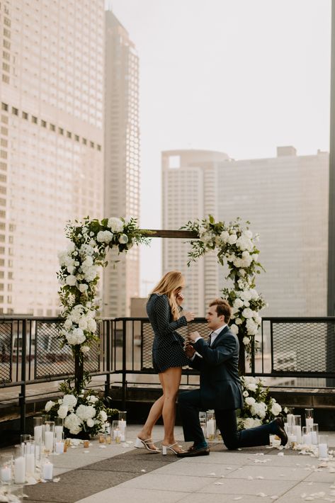 Chicago Rooftop Proposal Flowers and Candles Rooftop Engagement Party, Proposal Places, White Proposal, Social Table, Proposal Aesthetic, Wedding Proposal Ideas Engagement, Arch Ways, Savannah Elopement, City Proposal