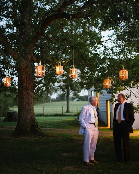 Outdoor Wedding Lighting Ideas from Real Celebrations Tree Lanterns Hanging Wedding, Outdoor Wedding Lighting Ideas, Lanterns Hanging From Trees, Lanterns In Trees, Hanging Tree Lights, Wedding On A Farm, Wedding Lighting Ideas, Outdoor Wedding Lighting, Wedding Venues In Virginia