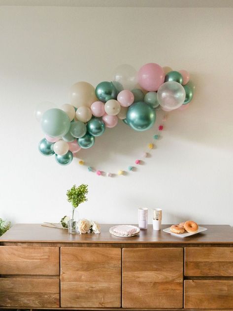 Tie together your magical party with our Shimmering Mermaid balloon arch kit, which can be hung or draped  anywhere you choose! The kit includes everything needed to create your very own balloon garland. **POM POMS NOT INCLUDED**

The kit comes with:

(Colors: baby pink, mint, chrome green, white sand and clear)

-5” and 11" latex balloons
-(1) Balloon decorating strip
-(1) Roll of glue dots
-(1) Dual action hand pump (Optional - HIGHLY RECOMMENDED!)
-Easy to follow step-by step-instructions. Mermaid Balloon Arch, Mermaid Balloon Garland, Mint Green Birthday, Magical Party, Mermaid Balloons, Chrome Green, 1 Balloon, Balloon Arch Kit, Clear Balloons