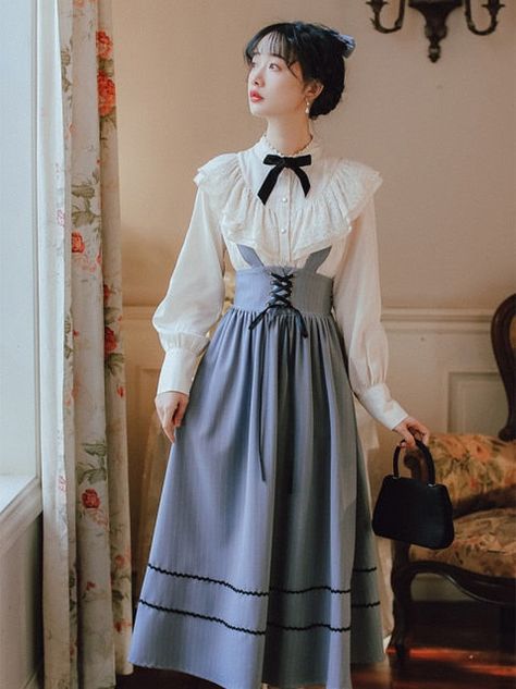 Sweet Lace Bow Shirt+Bandage Stripe Long Skirt Set BE642   Size(cm) Bust Shoulder Sleeve Length Shirt length Skirt waist Skirt length S 92 37 57 59 64cm with elastic 107cm included strap M 96 38 58 60 68cm with elastic 108cm included strap L 100 39 59 61 72cm with elastic 109cm included strap Pattern Type: SolidDecoration: BowStyle: England StyleClothing Length: RegularDresses Length: Mid-CalfSilhouette: A-LINEMaterial: Cotton, PolyesterClosure Type: Single BreastedSleeve Style: lantern SleeveSl Long Skirt Set, Preppy Aesthetic Outfits, Dark Academia Clothing, Burgundy Skirt, Bow Shirt, Bow Shirts, Gambar Figur, Langer Rock, Top Skirt Set