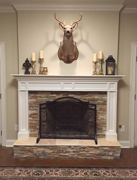 Deer, stone fireplace, mantle, stained concrete floors, basement, traditional mantle, stacked stone hearth, classic fireplace, BM Manchester Tan wall color Stained Concrete Floors Basement, Concrete Floors Basement, Resurface Fireplace, Fireplace Unique, Fireplace Romantic, Stone Fireplace Mantle, Lighting Fireplace, Build Fireplace, Fireplace Candles