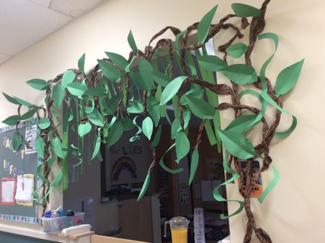 Jungle vines & leaves theme entry way I made out of butcher paper & construction paper.🌴🍃🍁🌿 Jungle Tree Classroom, Jungle Theme Homecoming Float, Diy Jungle Vines Brown Paper, Child Safety Activities, Jungle Classroom Transformation, Jungle Journey Vbs 2024 Decorations, Hawaii Decorations, Enchanted Forest Decorations, Preschool Classroom Decor