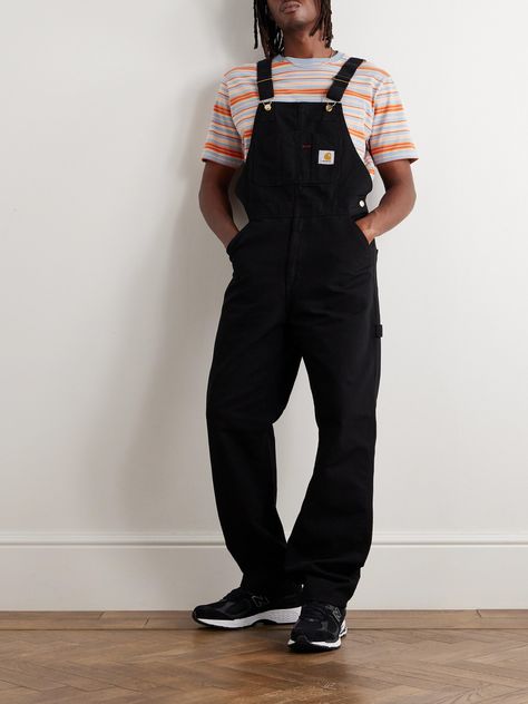 "Some garments are archetypally Carhartt WIP. Perhaps no garment encapsulates that quite as well as our Bib Overall"; explains the label of its signature model, which has been in production since the late 1800s. Made from hard-wearing 12oz. 'Dearborn' cotton-canvas, this black version is reinforced with bartack stitching at its stress points and has a multitude of pockets, plus a hammer loop. Carhartt Overalls Mens, Carhartt Overall, Canvas Overalls, Overalls For Men, Carhartt Dungarees, Fit Aesthetic, Carhartt Overalls, Overalls Men, Fits Aesthetic