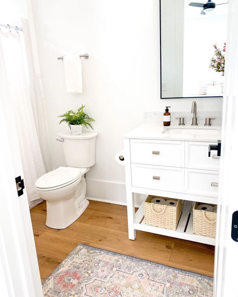 T A R A on Instagram: “Did you have to make tough cuts to save while building? We did LVP in some of the bathrooms instead of tile to help save. It turned out…” Lvp Flooring Bathroom, Lvp Flooring, Oak Bathroom, Coastal Bathrooms, Basement Bathroom, Guest Bathrooms, Boys Bathroom, Girls Bathroom, White Bathroom