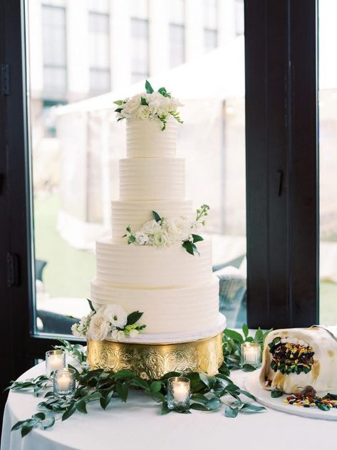 Simple, elegant five-tier wedding cake.| Bouquets of Austin |#weddingcake #elegantweddingcake #weddingcakedecor Five Tier Wedding Cake, 5 Tier Wedding Cakes, Tall Wedding Cakes, Gold Winter Wedding, 4 Tier Wedding Cake, Outdoor Winter Wedding, Winter Blooms, Dark Green Bridesmaid Dress, Creek Wedding