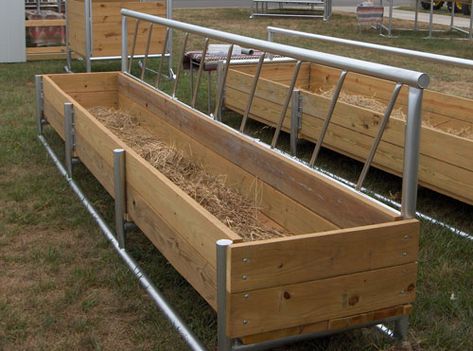 Combination hay and feed fence line bunk feeder is designed to hold hay and feed. The stanchion bars are welded 14″ apart to limit head movement, thus saving hay. The main frame is welded into a solid unit from heavy wall 2 1/2″ O.D. steel pipe along with 2″ x 8″ grade #1 treated lumber bolted on. The feeder measures 50″ from the ground to the top. Measures 25″ to the top of the side board.  Available in: 8′ / 12′ / 16′ lengths x 35″ wide x 16″ deep. Livestock Feeders, Cow Feeder, Cattle Gate, Horse Shelters, Hay Feeder For Horses, Cattle Feeder, Sheep Barn, Pasture Management, Goat Feeder