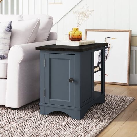 This end table with extra storage gives you plenty of spots to tuck away odds and ends in the living room. The frame is made from engineered wood with a distressed finish, and it's adorned with a scalloped apron for a French country look. Two open shelves are just right for boxes and tissues, while a rack on the other side accommodates all your magazines. We love how the cabinet door with three decorative black metal handles opens to reveal space for remotes, batteries, and a comfy throw blanket Block End Table, Painted End Tables, End Table Makeover, Tall Side Table, Small Lamps, End Table With Storage, Table Decor Living Room, Table Makeover, Living Room End Tables