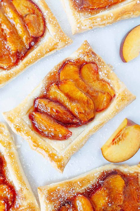 This puff pastry peach tart is delicious, fuss-free and perfect for warm-weather gatherings. With this recipe, you can whip up a delightful dessert quickly. Tart With Puff Pastry, Peach Tart Recipes, Peach Puff Pastry, Gluten Free Puff Pastry, Peach Tart, Puff Pastry Desserts, Easy Puff Pastry, Peach Desserts, Cheese Tarts