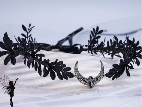 Transform your look into a captivating blend of mystique and elegance with our Black Moon Crown, a stunning accessory for Goth Wedding Cosplay Parties and beyond. This exquisite piece, featuring a Black Flower Circlet and Quartz Stone Crown, seamlessly combines the allure of dark florals with the enchantment of celestial elements. 🌑 Dark Elegance: Our Black Moon Crown is adorned with intricate black flowers, each carefully crafted to capture the essence of gothic beauty. The dark florals add a Goth Wedding Crown, Dark Fairy Accessories, Dark Fantasy Crown, Dark Fairy Wedding, Intricate Headpiece, Nyx Aesthetic, Dark Fairy Crown, Witchy Wardrobe, Crown Dark