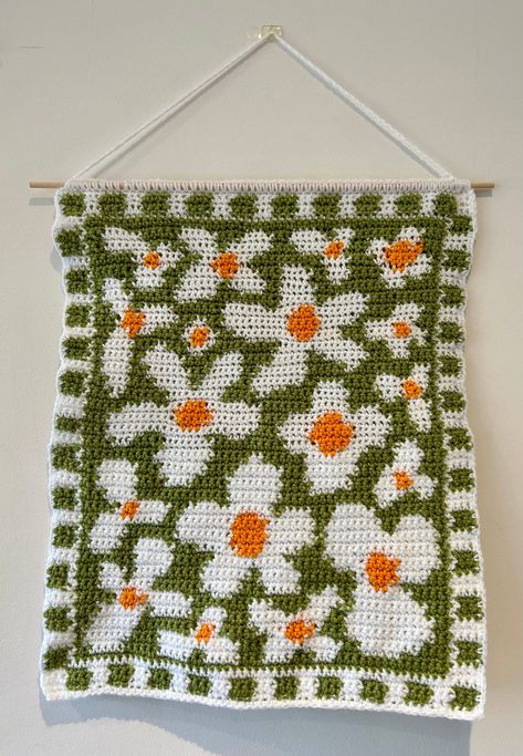 Make your own flower crochet tapestry! This pattern includes instructions that have been written out in 3 different ways:  1. Stitch Fiddle Graph  2. Colour Block Instructions  3. Written Instructions  Materials needed:  - 4mm crochet hook (can use other sizes at your own discretion) - White DK wool  - Green DK wool  - Yellow DK wool  - Dowel rod - Scissors - Darning needle Stitches used in pattern:  - Single chain (sc) - Double chain (dc) This pattern uses US crochet terminology.  Pattern is in English.  This product is a DIGITAL FILE, downloaded as a PDF that will be available instantly once payment has been received.  Please do not hesitate to contact me if you have any questions! Thank you :) Gen Z Crochet Patterns, Christian Tapestry Crochet, Tapestry Crochet Squares, 2 Color Tapestry Crochet, Crochet Tapestry Pattern Free Small, Tapestry Crochet Flower, Free Tapestry Crochet Patterns, Crochet Tapestry Ideas, Tapestry Crochet Ideas