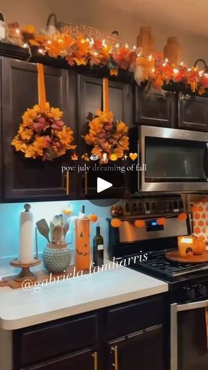 14K views · 4.6K reactions | Autumn 🍂🍁🕯️☕️🧦🧸🧡…. #inspo   -Wreath & ribbon from Hobby Lobby  -Garland over cabinet from Hobby Lobby. Placed on a orange pool noodle to get layered look. -Jars from Dollar Tree, added pumpkins on top of lid. -Pumpkin plates from hobby lobby  -ladder on counter from Hobby Lobby  -mugs from Homegoods & Marshalls  . . . . . . . #fall #falldecor #fallstyle #fallhaul #kitchenfall #fallkitchen #autumn #autumnvibes🍁 #autumnaesthetic #autumndecor #fallhomedecor #pumpkin #pumpkinspice #pumpkinaesthetic #fallgarland #wreath #diywreath #fallwreath #christmas #christmaswreath #diyfall #thanksgiving #thanksgivingaesthetic #thanksgingdecor  #fallcoffee #coffeebar #diychristmas #fallinspo | 𝐆𝐀𝐁𝐑𝐈𝐄𝐋𝐀 | gabriela.harrisfam · Original audio Fall Wreaths For Kitchen Cabinets, Garland Above Kitchen Cabinets, Hobby Lobby Fall Decor Ideas, Hobby Lobby Fall Decor, Pumpkin Plates, Fall Decor Kitchen, Wreath Kitchen, Wreath Ribbon, Cocoa Coffee