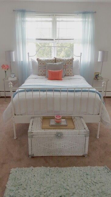 White bedroom with pops of blue and coral! End tables from Ross Bed from Ikea Pillows from HomeGoods Grey pillow was a DIY DIY chest from thrift shop (painted) Tray from Biglots Bedding from Ross Rug from Ross Bedroom With White Metal Bed, Ikea Beds, Diy Chest, White Metal Bed, Ikea Pillows, Grey Pillow, Ikea Bedroom, Ikea Bed, Casa Vintage