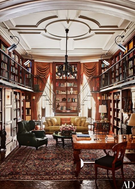 The double-height library is an ode to Solomon’s love of books. The windows and Couturier-designed sofa are dressed in silk damask  | archdigest.com New York City Townhouse, City Townhouse, Casa Retro, Dream Library, Beautiful Library, Library Room, Home Library Design, Home Libraries, Library Design