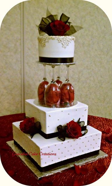 black and gold cakes | Elegant Ivory Wedding Cake with Gold, Black and Red accents | Flickr ... Wedding Cakes Red, Red Rose Wedding Cake, Wedding Cake With Gold, Black And Gold Cake, Cake With Gold, Ivory Wedding Cake, Black Wedding Cakes, Quince Ideas, Fancy Wedding