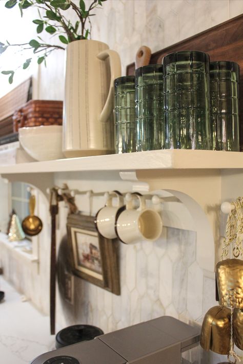 Close to six months into this kitchen renovation, we’re finally at the finishing steps, which includes making this DIY cottage peg rail shelf that gives me at least one little finished corner of the room to look at and see progress. It’s the perfect addition to an otherwise blank wall and it adds some functional but aesthetic storage. The best part? The materials only cost about $65 and it was a one-day project. Peg Rail Shelf, Neutral Kitchen Designs, Rail Shelf, Diy Cottage, Corbel Shelf, Peg Rail, Shaker Pegs, Shoji White, Diy Herb Garden