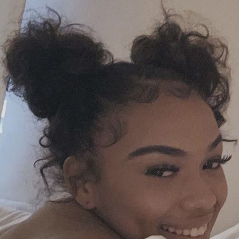 Beautiful Space Bun Hairstyles for Women 2 Messy Buns Curly Hair, Space Buns With Edges, Space Bun Hairstyles For Black Women, Two Space Buns Curly Hair, Messy Space Buns Curly Hair, Two Low Buns Curly Hair, Curly Space Buns Black Women, Curly Bun Black Women, 2 Buns Hairstyle Black Natural Hair