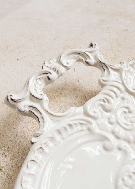 Artisans in northern Italy salvaged vintage molds to bring forth the enchanting Finezza collection. Adorned with intricate lace patterns and a touch of nostalgic tone of glaze, this two-handled tray makes for a splendid addition to your serveware collection - or simply leave it on display and let the timeless charm grace your space! Many of our ceramic pieces are finished with distressing, drips, color variations and/or fine lines in the glaze. These qualities are intentional, and reflect the ge Silver Trays, Northern Italy, Tea Cakes, Lace Patterns, Serveware, Color Variations, Tray, Make It Yourself, Ceramics