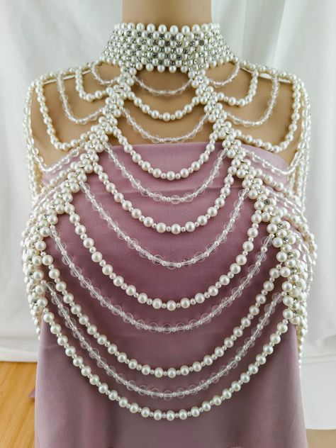 Welcome to AaiKhodalCreation！ Bridal Pearl Shoulder Necklace, Vintage Wedding Shoulder Jewelry, Pearl Body Jewelry, Statement Neckpiece If you would like to add an amazing look to your outfit, This pearl Shoulder Necklace will be the most special first choice. The metal chain closure at back is flexible enough to fit most sizes. You can adjust the length to a perfect fit with the extension chain. It can be easy to put on and take off, the best accessory for a weddings or proms, gather the most c Beaded Shoulder Jewelry, Shell Shoulder Necklace, Pearl Shoulder Jewelry, Body Jewelry Outfit, Bridal Shoulder Necklace Gold, Shoulder Necklace Pearl, Pearl Outfit, Beads Clothes, Choker Necklace Designs