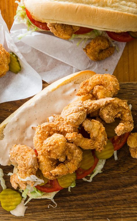 Shrimp Po’ Boys: If a trip to Louisiana isn’t in the cards, our Shrimp Po’ Boy recipe will give you a good substitute right at home. A three-step process of dredge-dip-dredge makes the batter stick to the shrimp and boost crunchiness. Po Boy Sandwich, Cooks Country, Donut Toppings, Shrimp Po Boy, French Bread Recipe, Cookie Toppings, Remoulade Sauce, America's Test Kitchen Recipes, Kitchen Recipe