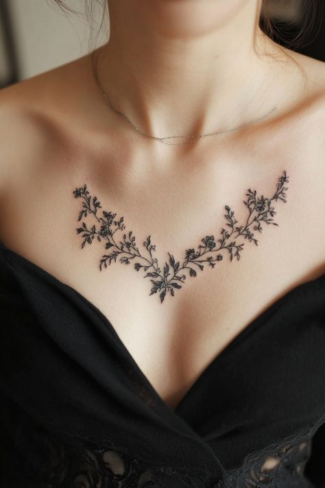 Delicate floral tattoo on a woman's upper chest above a black neckline. Small Chest Tattoo Female Simple, Middle Chest Tattoos For Women, Women’s Full Chest Tattoo, Intricate Back Tattoo, Tattoo Ideas Female On Chest, Girl Chest Tattoo, Unique Chest Tattoo Female, Floral Chest Tattoo Female, Chest Tattoo Ideas For Women