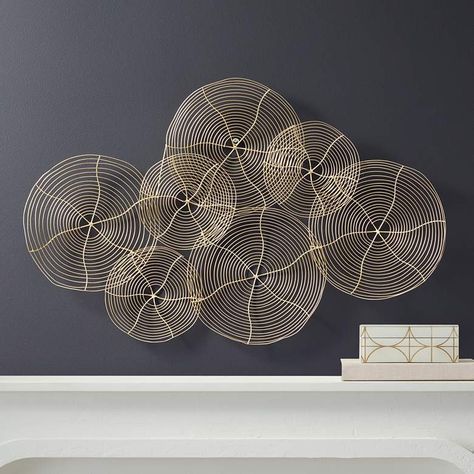 Ethereal lightness permeates the soft elegance of spirited nuanced art, bringing a sense of delicacy to a modern space. This contemporary metal wall art by Dahlia Studios offers overlapping metal circles with exceptional detail and a glossy gold finish. With a nod to organic study of artistry, this gallery-inspired piece adds a lighthearted ambiance to a main living space, master suite, or hallway wall. Gold Metal Wall Art, Contemporary Metal Wall Art, Keyhole Hanger, Hallway Wall, Modern Spaces, Metal Construction, Master Suite, Dahlia, Gold Finish