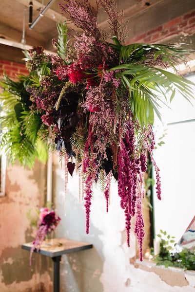 This hanging floral installation is giving us all of the boho vibes! | wedding, wedding planning, floral event design, boho wedding, elegant wedding, modern wedding, simple wedding decor, wedding decor, 2023 bride, dream wedding, wedding inspiration, lace wedding dress, floral arrangements, wedding design, event design, floral design, florist, dc wedding, dc florist, washington dc wedding, wedding photos, wedding guest list, wedding ideas, wedding ceremony, wedding photography, suspended floral Guest List Wedding Ideas, Guest List Wedding, Simple Wedding Decor, Hanging Floral Installation, Wedding Dress Floral, Wedding Cake Tops, Floral Installation, Simple Wedding Decorations, Flower Chandelier