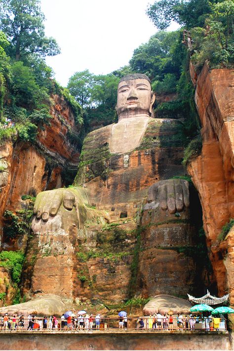 Standing a whopping 71-meters-high, Leshan Giant Buddha is the world’s largest Buddha sculpture and one of the most popular tourist attractions in China. Leshan Giant Buddha, Underrated Travel Destinations, Giant Buddha, Amazing Places To Visit, Buddha Sculpture, Chinese Landscape, Big Buddha, Travel Wishlist, Tourist Spots