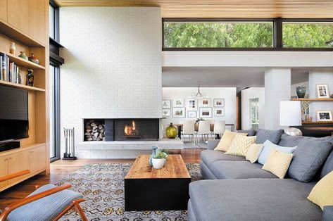 Inside a mid-century home reimagined with stunning details on Lake Austin White Brick Wall Living Room, Brick Wall Living Room, White Brick Fireplace, Contemporary Family Room, Clerestory Windows, House Layout, Living Modern, Exposed Brick Walls, Luxe Interiors