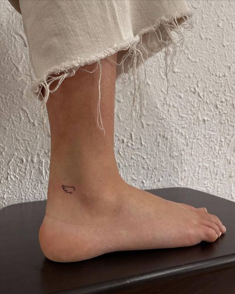 Feet Minimalist Tattoo, Minimal Ankle Tattoos For Women, Ankle Line Tattoos For Women, Small Ankle Tattoo Placement, Minimalist Tattoo For Healing, Minimal Tattoo Ankle, Angel Wings On Ankle, Angel Wing Tattoo Fine Line, Leg Tattoos Minimalist