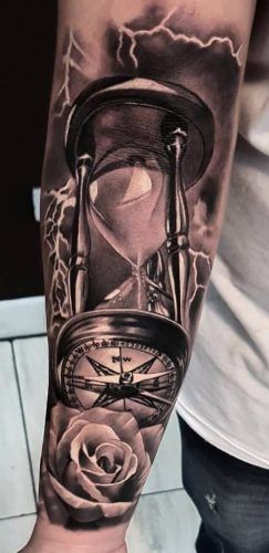 Find Your Direction: 20 Compass Tattoo Ideas for Men Compass Watch Tattoo Design, Mens Time Tattoos, Pocket Watch Compass Tattoo, Mens Hourglass Tattoo Ideas, Hourglass With Roses Tattoo, Clock Tattoo Design For Men Leg, Hourglass And Compass Tattoo, Hourglass Design Tattoo, Hourglass Compass Tattoo