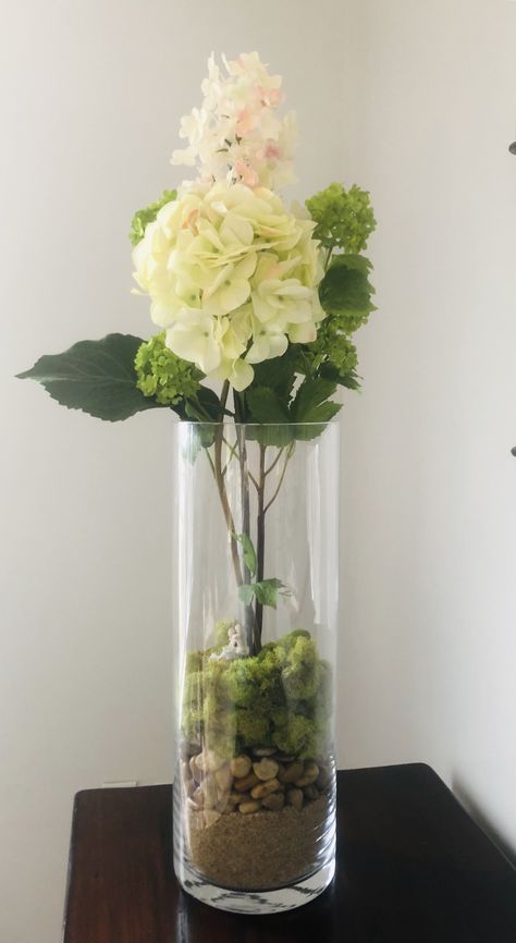 Faux Stems In Clear Vase, Clear Vase With Greenery, Clear Glass Flower Arrangement, Clear Vases With Flowers, Clear Cylinder Vase Ideas, Wedding Vase Filler Ideas, Tall Glass Vases Decor Ideas, Long Glass Vase Decor Ideas, Tall Clear Vase Decorating Ideas