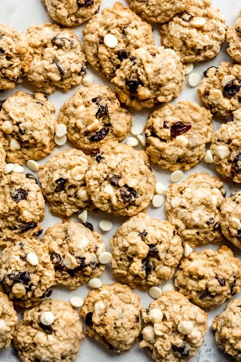 White Chocolate Cherry Oatmeal Cookies - Pretty much my all-time favorite cookie! Oats, white chocolate chips, dried cherries, and a drizzle of white chocolate to top if off, if you're feeling a little fancy. THE BEST. So easy to make, and the recipe easily feeds a crowd! #oatmealcookies #cookierecipe #chocolatecherry #valentinesdayrecipes #christmascookies #easyrecipes #homemadecookies #bluebowlrecipes | bluebowlrecipes.com Cookies With Dried Cherries, Cookie Oats, Cookies With White Chocolate Chips, Cherry Oatmeal Cookies, Cherry Oatmeal, White Chocolate Cherry, Cookies With White Chocolate, Cookie Board, Monster Cookie